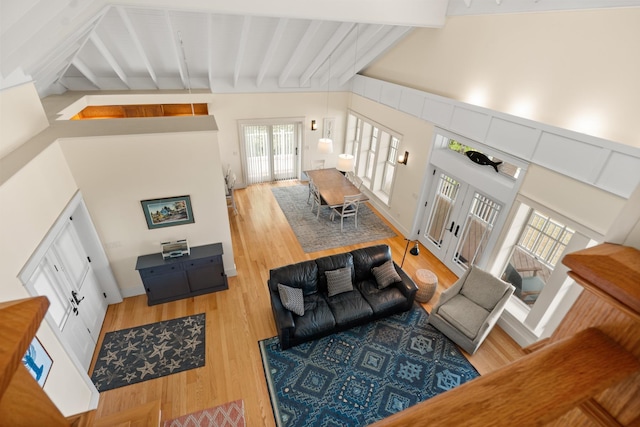 8 Wisteria Ln, Eliot, ME 03903 - living room featuring beamed ceiling and light wood-style floors