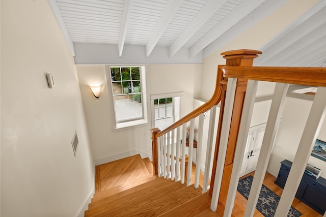 8 Wisteria Ln, Eliot, ME 03903 - stairs featuring wood finished floors, beamed ceiling, and baseboards