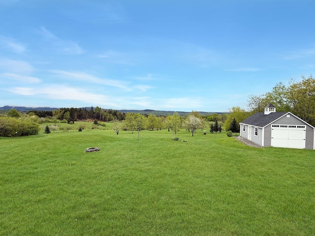 718 Reed Rd, Colebrook, NH 03576 - view of green lawn with an outbuilding and a garage
