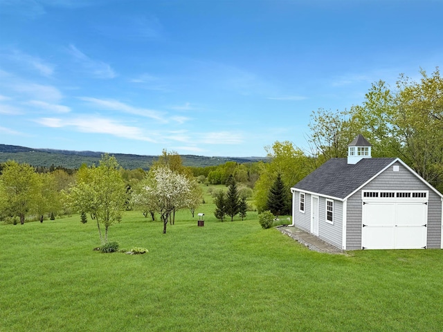 718 Reed Rd, Colebrook, NH 03576 - view of green lawn featuring an outdoor structure and a garage