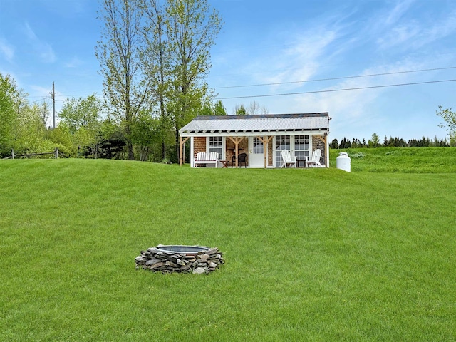 718 Reed Rd, Colebrook, NH 03576 - view of front of house with a front lawn and an outdoor fire pit