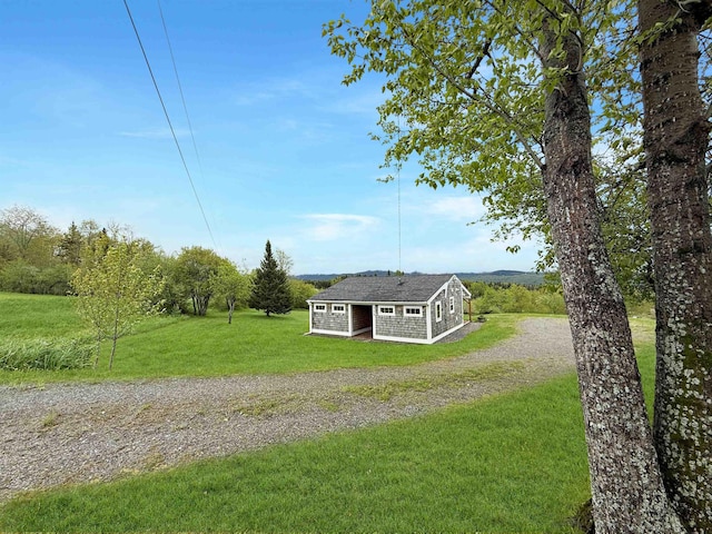 718 Reed Rd, Colebrook, NH 03576 - view of front of property with driveway, a front lawn, and an outbuilding