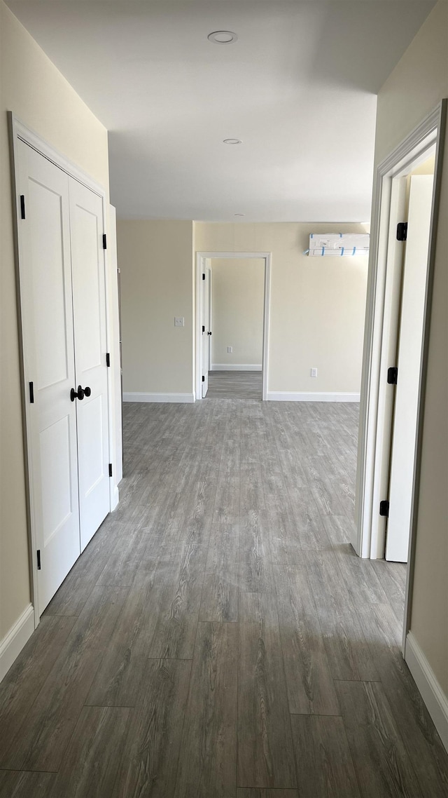 725 Central Ave Unit 101, Dover, NH 03820 - hallway with dark wood-style flooring and baseboards