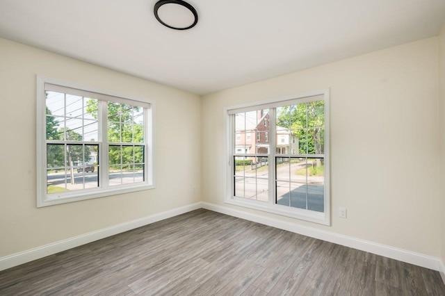 725 Central Ave Unit 101, Dover, NH 03820 - empty room with baseboards and wood finished floors