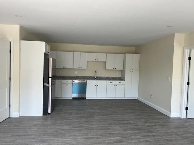 725 Central Ave Unit 101, Dover, NH 03820 - kitchen featuring dishwasher, freestanding refrigerator, dark wood finished floors, dark countertops, and white cabinets
