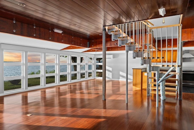 430 Clearwater Rd, Shelburne, VT 05482 - stairs featuring wood ceiling, wood finished floors, and baseboards