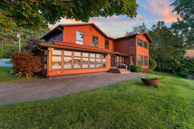 430 Clearwater Rd, Shelburne, VT 05482 - view of front facade featuring a yard and decorative driveway