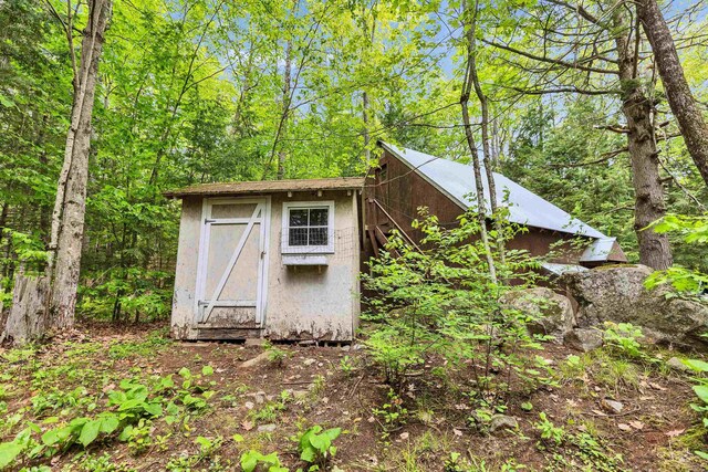 29 Centennial Dr, Webster, NH 03303 - view of shed featuring a view of trees