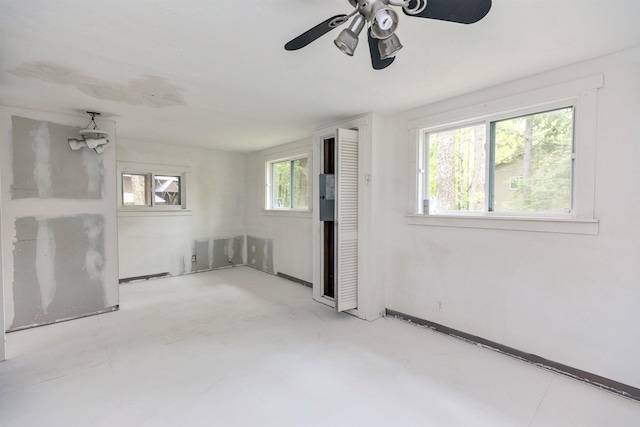29 Centennial Dr, Webster, NH 03303 - spare room featuring a ceiling fan and baseboards