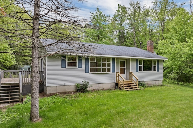 406 Lower Ridge Rd, Loudon, NH 03307 - view of front facade featuring a chimney, a wooden deck, and a front lawn