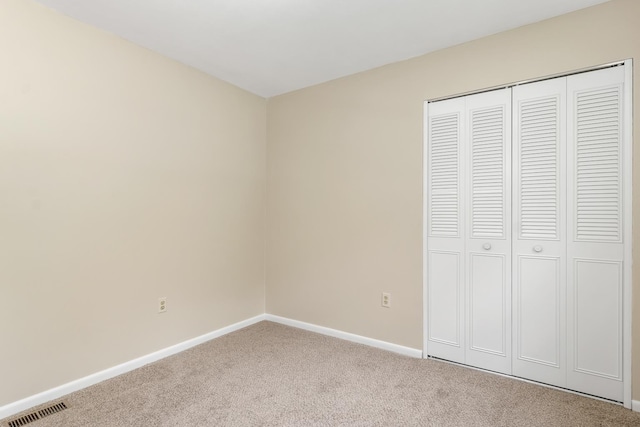 406 Lower Ridge Rd, Loudon, NH 03307 - unfurnished bedroom with carpet flooring, baseboards, and a closet