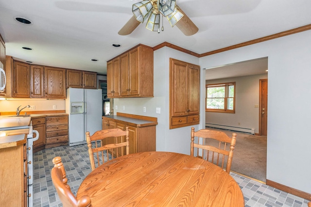 29 Laurel St, Goffstown, NH 03045 - kitchen featuring white fridge with ice dispenser, baseboard heating, ceiling fan, range with electric cooktop, and brown cabinetry