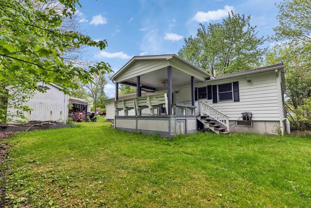29 Laurel St, Goffstown, NH 03045 - rear view of property featuring a lawn and ceiling fan
