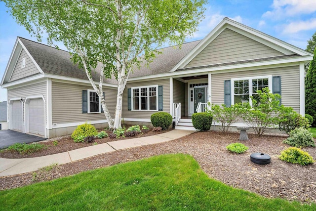5 Smithfield Ln, Bedford, NH 03110 - view of front of home with driveway and roof with shingles