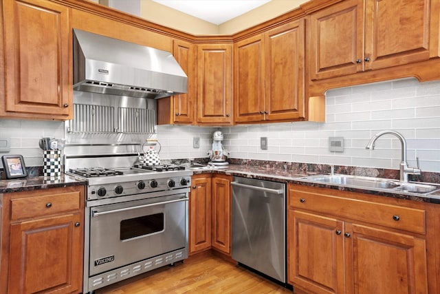 5 Smithfield Ln, Bedford, NH 03110 - kitchen with stainless steel appliances, wall chimney exhaust hood, a sink, and brown cabinets