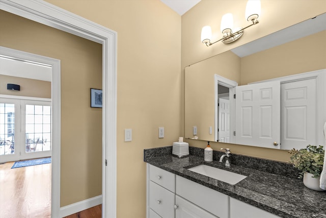 5 Smithfield Ln, Bedford, NH 03110 - bathroom with vanity, wood finished floors, and baseboards