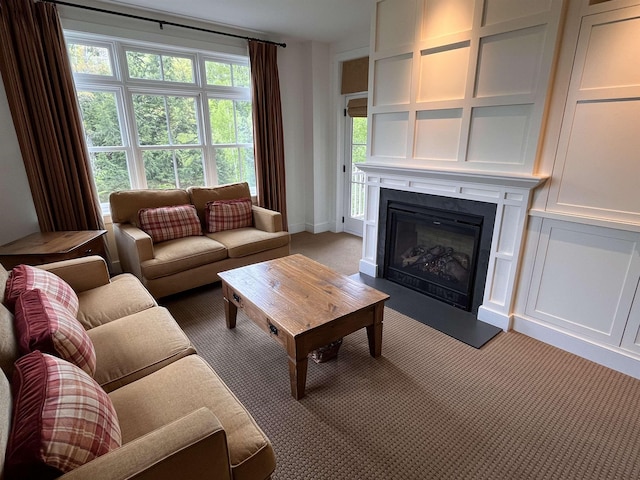 102 Forest Drive 310Interval I W/Lockout 308, Warren, VT 05674 - living room featuring light carpet, a glass covered fireplace, and baseboards