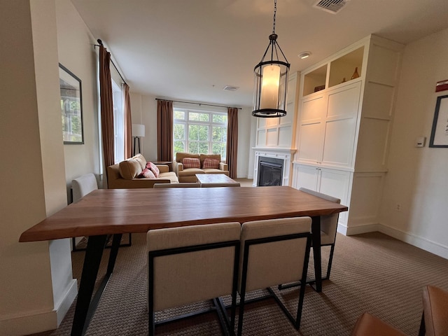 102 Forest Drive 310Interval I W/Lockout 308, Warren, VT 05674 - dining area with a fireplace, dark carpet, and baseboards