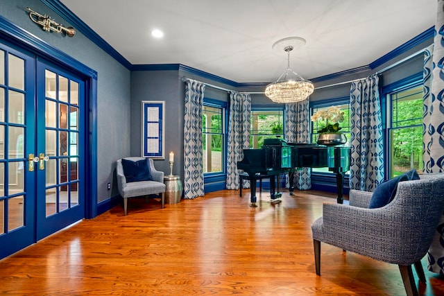 52 Hardy Rd, Bedford, NH 03110 - sitting room with a chandelier, crown molding, french doors, wood finished floors, and recessed lighting