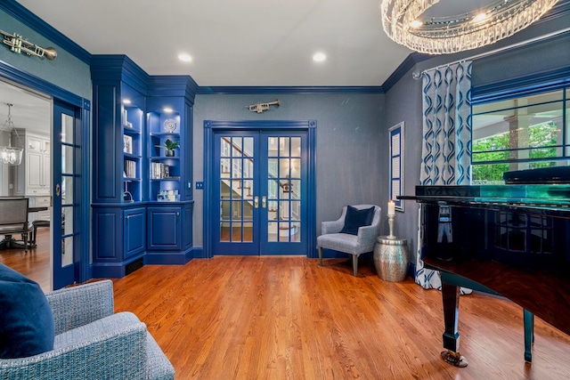 52 Hardy Rd, Bedford, NH 03110 - living area featuring french doors, crown molding, and wood finished floors