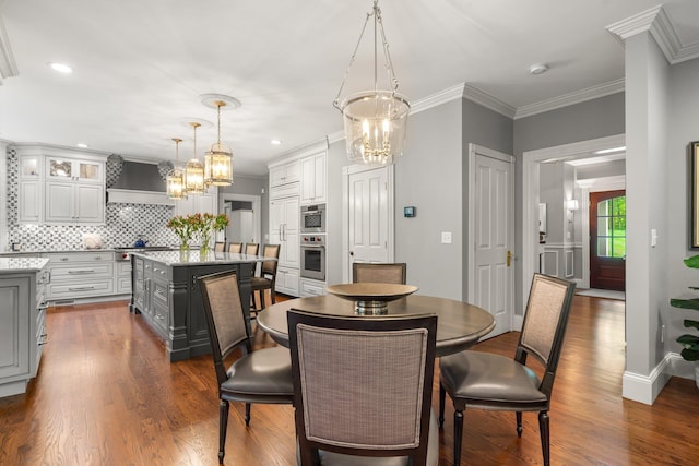 52 Hardy Rd, Bedford, NH 03110 - dining room with a chandelier, dark wood-style flooring, ornamental molding, recessed lighting, and baseboards