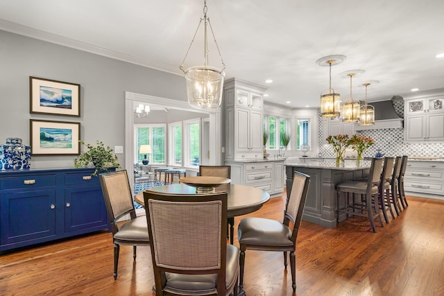 52 Hardy Rd, Bedford, NH 03110 - dining area featuring a chandelier, crown molding, plenty of natural light, wood finished floors, and recessed lighting