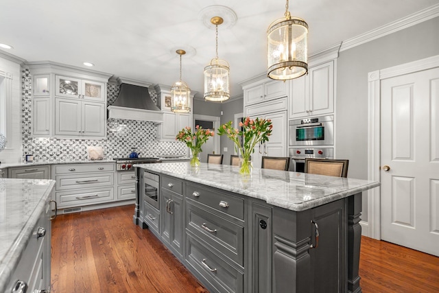 52 Hardy Rd, Bedford, NH 03110 - kitchen featuring custom range hood, decorative backsplash, appliances with stainless steel finishes, dark wood-type flooring, and recessed lighting