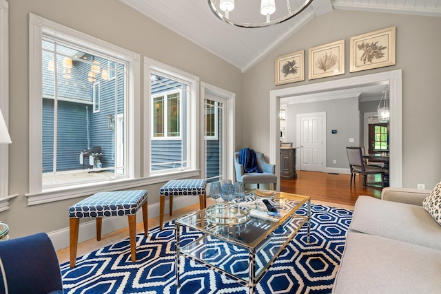 52 Hardy Rd, Bedford, NH 03110 - living area with wood finished floors, baseboards, ornamental molding, and a chandelier