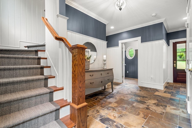 52 Hardy Rd, Bedford, NH 03110 - entryway with crown molding, stone tile floors, a decorative wall, stairs, and wainscoting