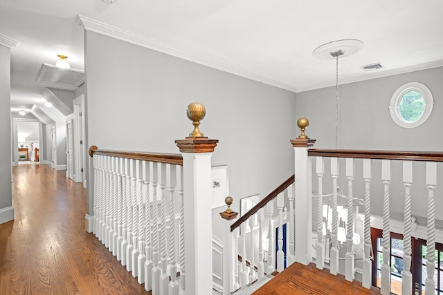 52 Hardy Rd, Bedford, NH 03110 - hall featuring attic access, wood finished floors, ornamental molding, an upstairs landing, and baseboards