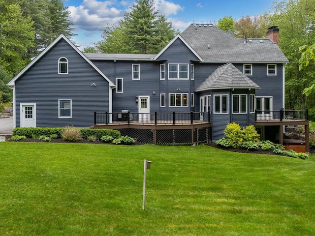 52 Hardy Rd, Bedford, NH 03110 - rear view of house with a wooden deck, a chimney, and a lawn