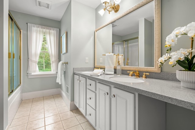 52 Hardy Rd, Bedford, NH 03110 - bathroom featuring double vanity, tile patterned flooring, and baseboards