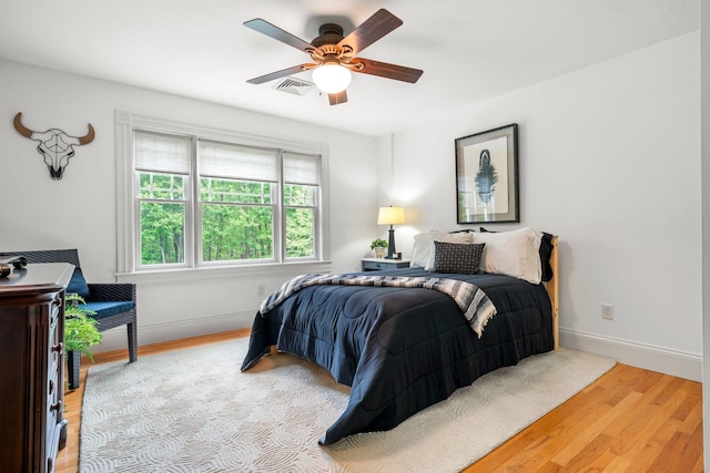 52 Hardy Rd, Bedford, NH 03110 - bedroom with wood finished floors, baseboards, and a ceiling fan
