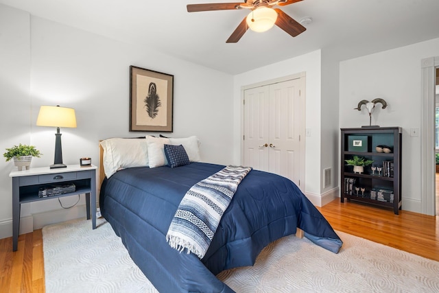 52 Hardy Rd, Bedford, NH 03110 - bedroom with wood finished floors, a closet, ceiling fan, and baseboards