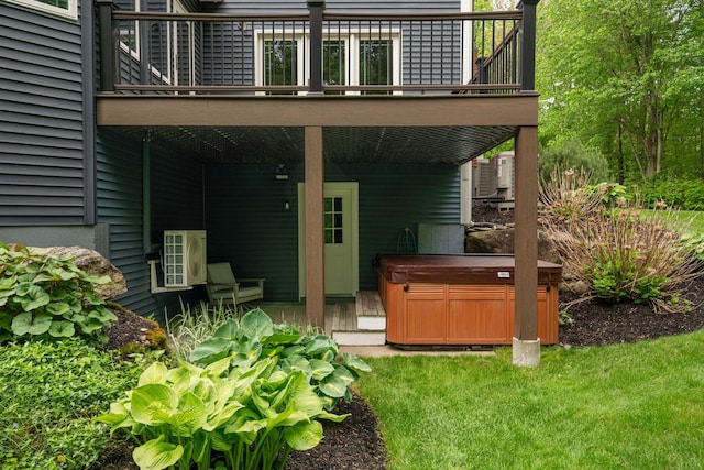52 Hardy Rd, Bedford, NH 03110 - rear view of property featuring a hot tub, a deck, and a yard