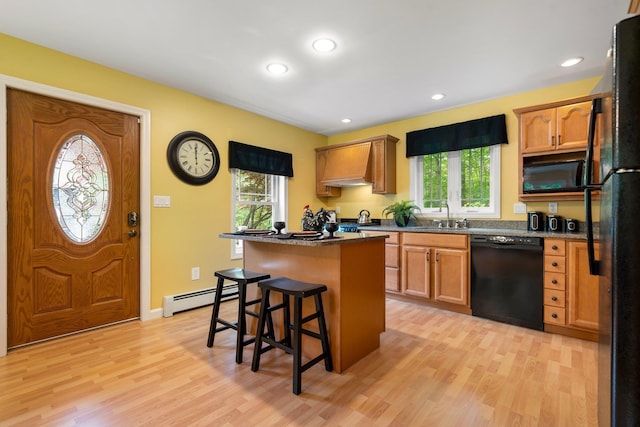 52 Hardy Rd, Bedford, NH 03110 - kitchen with black appliances, healthy amount of natural light, light wood-style flooring, a kitchen island, and recessed lighting