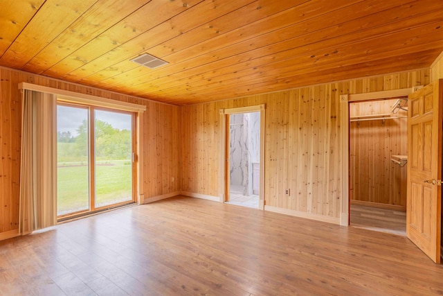 122 Flagg Rd, Rochester, NH 03839 - spare room with wood ceiling, wood finished floors, and wooden walls