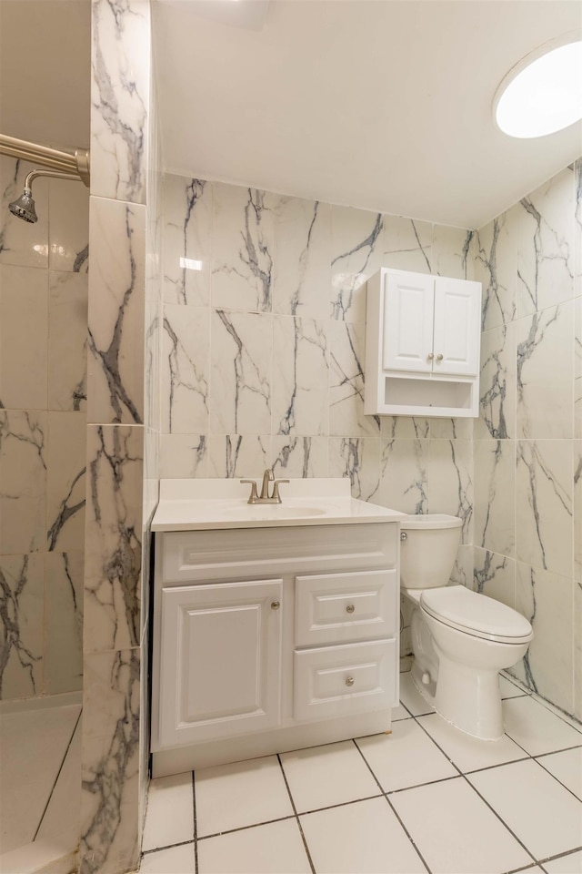 122 Flagg Rd, Rochester, NH 03839 - bathroom with a marble finish shower, vanity, toilet, and tile walls