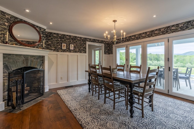1640 Three Maple Dr, Manchester, VT 05255 - dining area featuring dark wood-style flooring, a wainscoted wall, a chandelier, a decorative wall, and crown molding