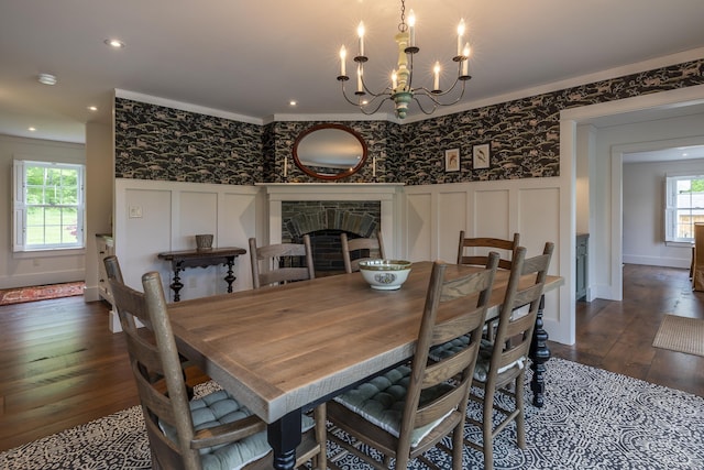 1640 Three Maple Dr, Manchester, VT 05255 - dining room with a decorative wall, dark wood-type flooring, wallpapered walls, crown molding, and a chandelier