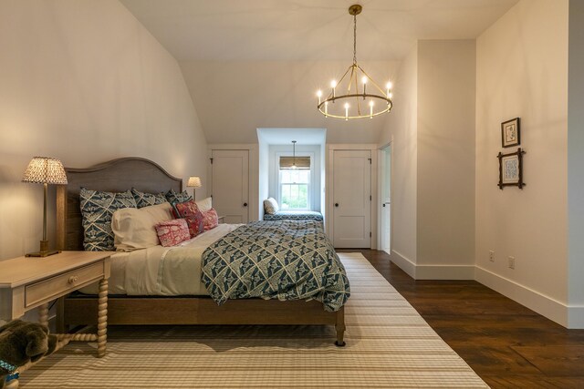1640 Three Maple Dr, Manchester, VT 05255 - bedroom with a chandelier, baseboards, dark wood-style flooring, and vaulted ceiling