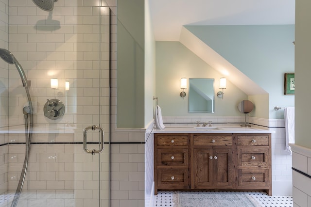 1640 Three Maple Dr, Manchester, VT 05255 - bathroom with a stall shower, vanity, tile walls, and a wainscoted wall