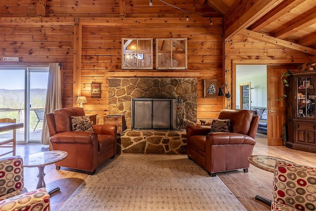 31 Highland View Rd, Weston, VT 05161 - living room featuring light wood finished floors, wood walls, a fireplace, and wood ceiling
