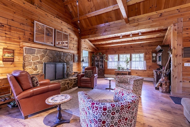 31 Highland View Rd, Weston, VT 05161 - living area with wood walls, wood finished floors, a fireplace, and wooden ceiling