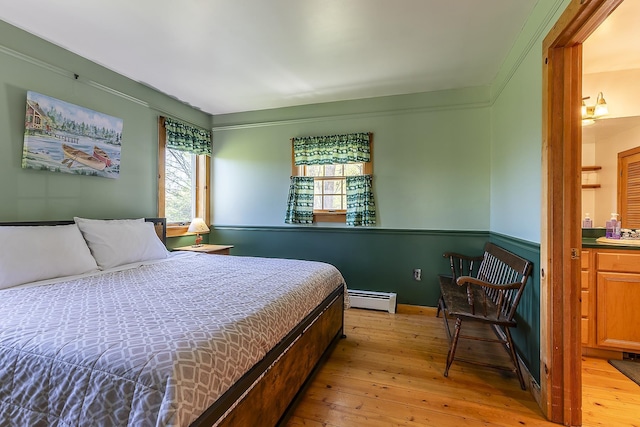 31 Highland View Rd, Weston, VT 05161 - bedroom with a baseboard heating unit and light wood-style flooring