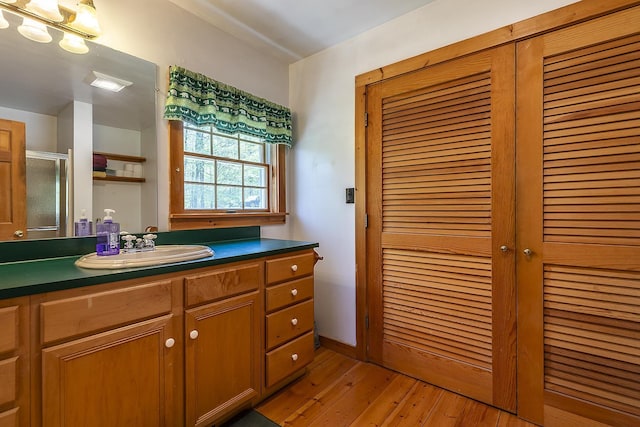 31 Highland View Rd, Weston, VT 05161 - full bath featuring vanity, hardwood / wood-style flooring, and a shower stall