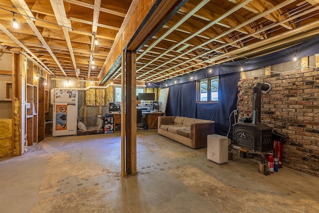 31 Highland View Rd, Weston, VT 05161 - below grade area with a wood stove and brick wall
