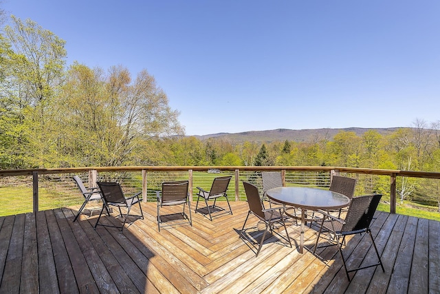 31 Highland View Rd, Weston, VT 05161 - wooden deck with outdoor dining area and a view of trees