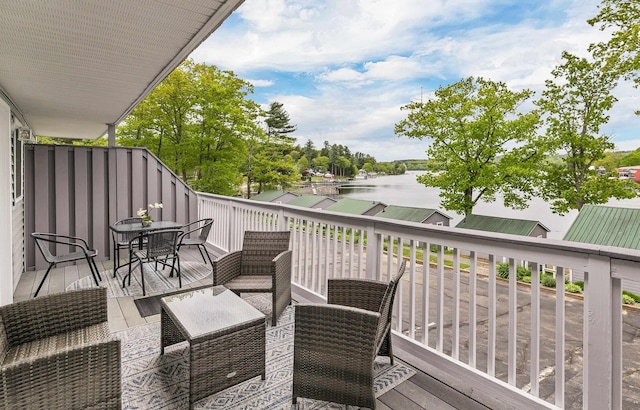 1144 Weirs Blvd Unit 20, Laconia, NH 03246 - wooden terrace featuring a water view and outdoor dining space