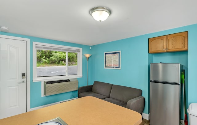 1144 Weirs Blvd Unit 20, Laconia, NH 03246 - living room featuring an AC wall unit and baseboards